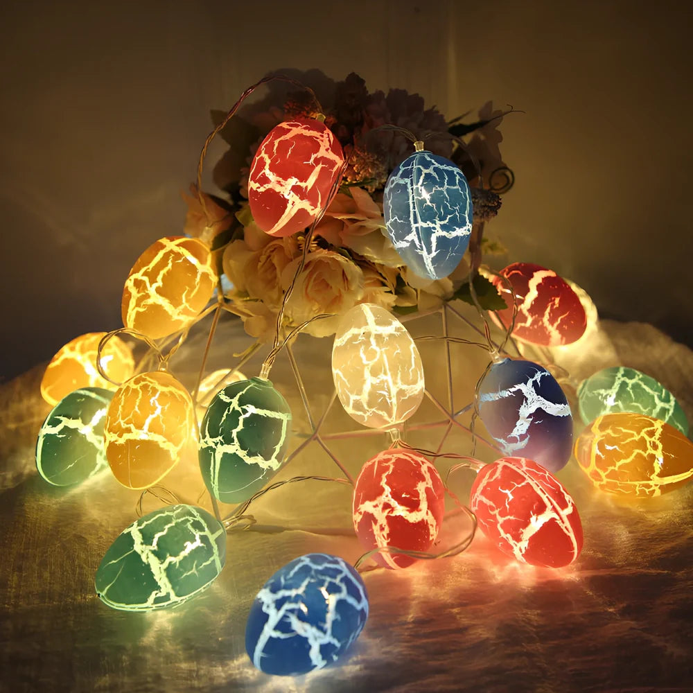 Crack egg LED string lights shaped around window with coloured plastic shells and flexible cable