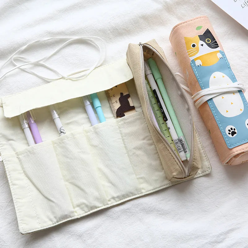 Korean-style rolling pencil case with cartoon cat print and zip, in blue, green, pink and yellow colours.