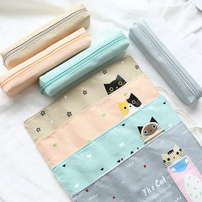 Korean-style rolling pencil case with cartoon cat print and zip, in blue, green, pink and yellow colours.