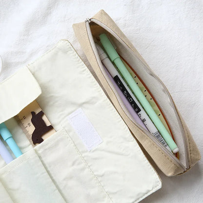 Korean-style rolling pencil case with cartoon cat print and zip, in blue, green, pink and yellow colours.