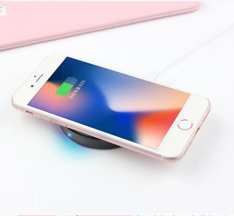 Square wireless charging base with Qi logo, measuring 69mm, available in six colours including black, blue, orange, red, white, and yellow