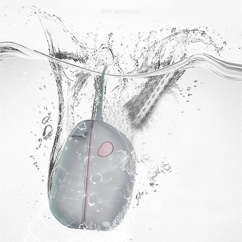 Foldable Portable Electric Tooth Flush in black and silver grey, compact design for travel