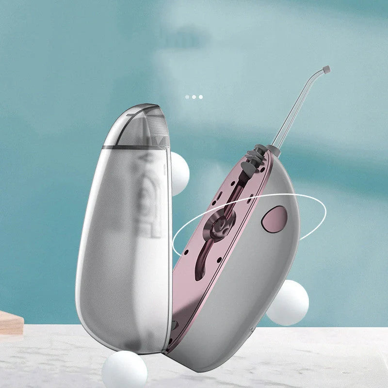 Foldable Portable Electric Tooth Flush in black and silver grey, compact design for travel