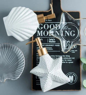Ceramic soap dispenser with embossed starfish or shell design for elegant bathroom decor