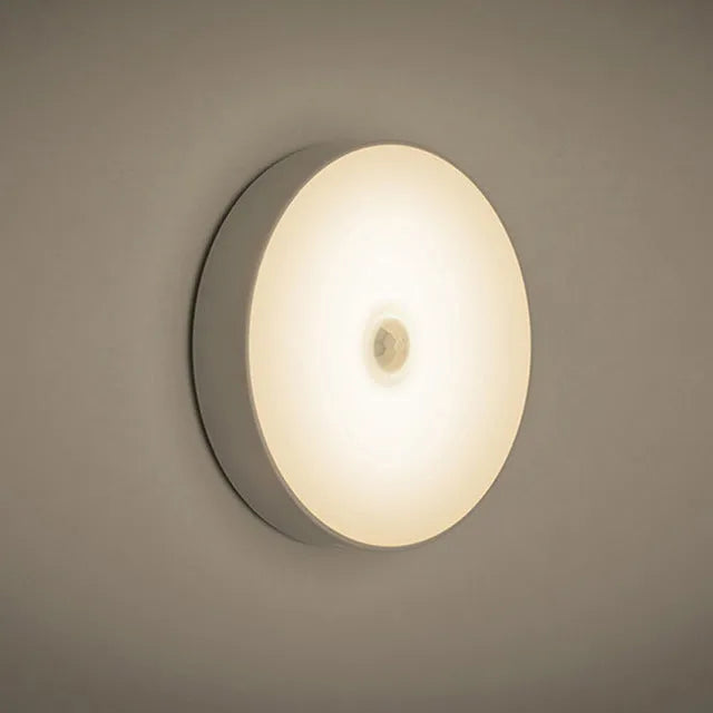 LED body sensing night light with USB charging, 86mm diameter, in beige or white, showing 3M tape for installation