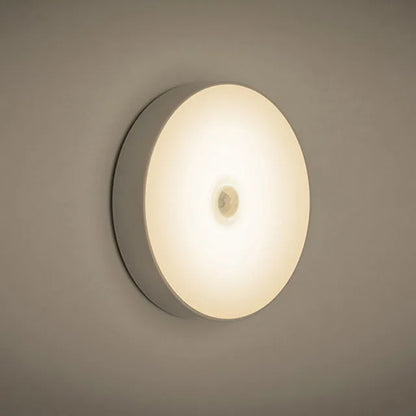 LED body sensing night light with USB charging, 86mm diameter, in beige or white, showing 3M tape for installation