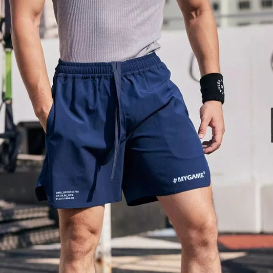 Men's grey fitness shorts with moisture-wicking fabric during workout exercise