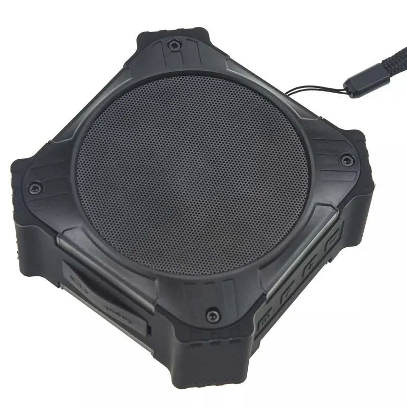 Compact black waterproof Bluetooth speaker with a wrist strap, showing its size and durable ABS plastic construction.