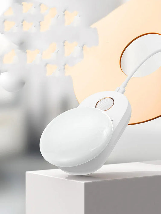 Baseus white sensor night light with circular design showing LED illumination and motion detection sensor
