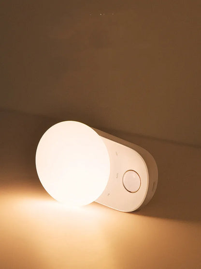 Baseus white sensor night light with circular design showing LED illumination and motion detection sensor