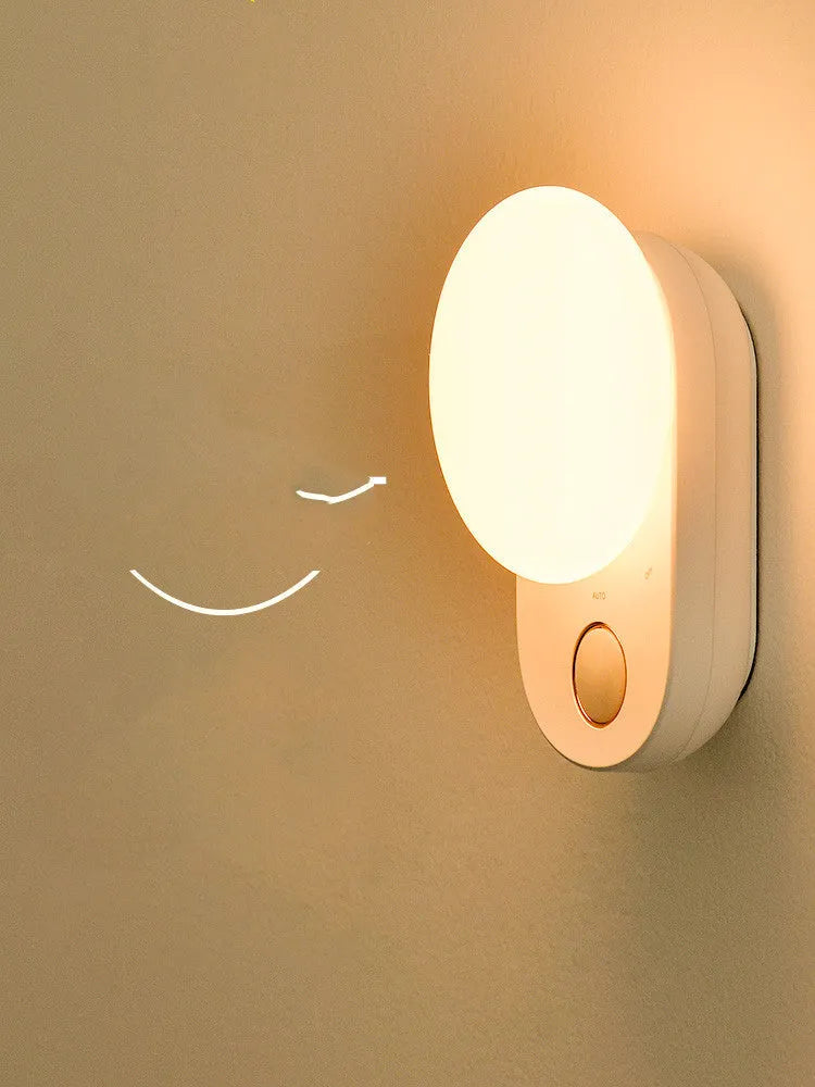Baseus white sensor night light with circular design showing LED illumination and motion detection sensor