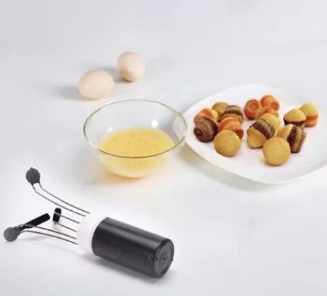 White and black wireless automatic kitchen stirrer with three-speed button, shown next to a saucepan.