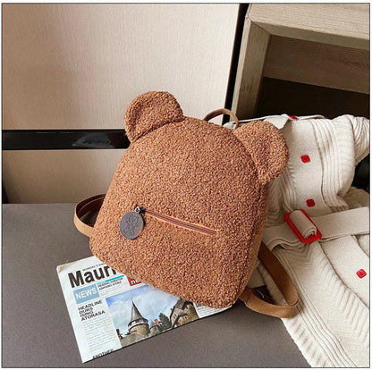 Adorable bear-shaped backpack made of soft, cozy fleece material in multiple color options for children and women
