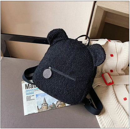 Adorable bear-shaped backpack made of soft, cozy fleece material in multiple color options for children and women