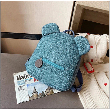 Adorable bear-shaped backpack made of soft, cozy fleece material in multiple color options for children and women