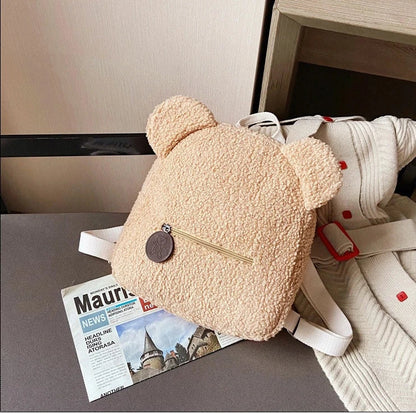 Adorable bear-shaped backpack made of soft, cozy fleece material in multiple color options for children and women