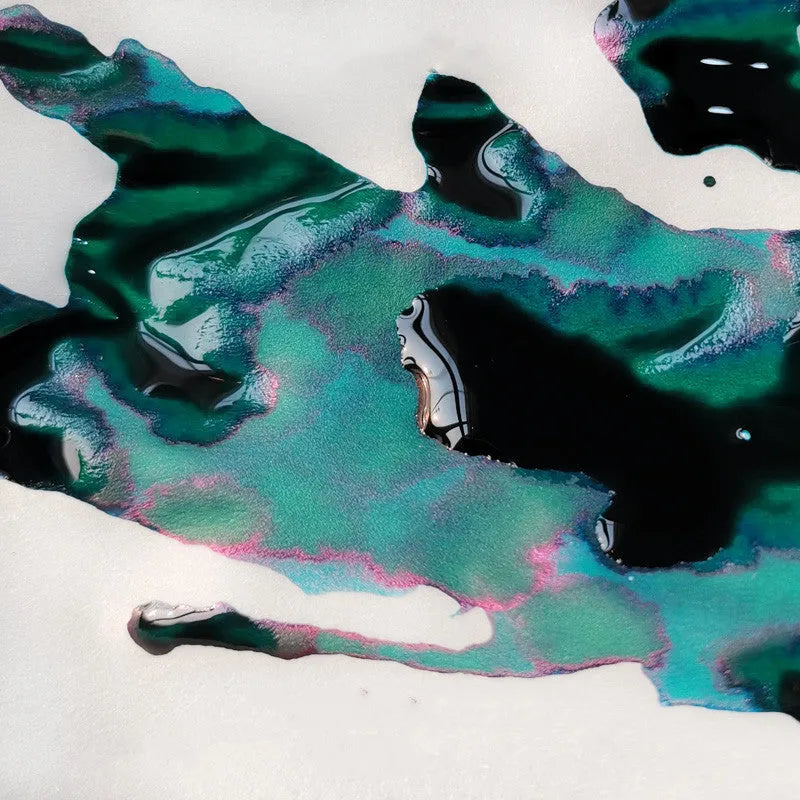 Bottle of strong sheen gradient fountain pen ink with gold powder particles in Red Tide colour.