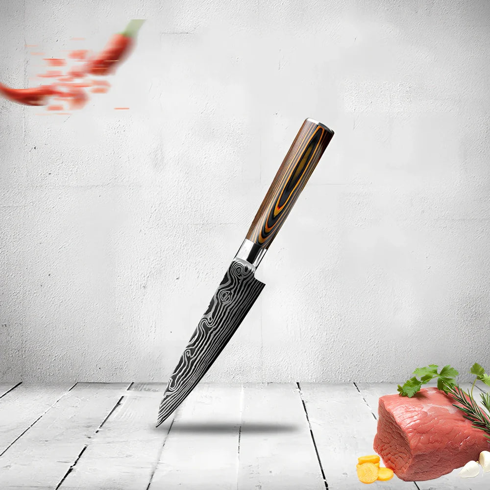 Laser pattern knife set with stainless steel chef, slicing, and fruit knives on a cutting board