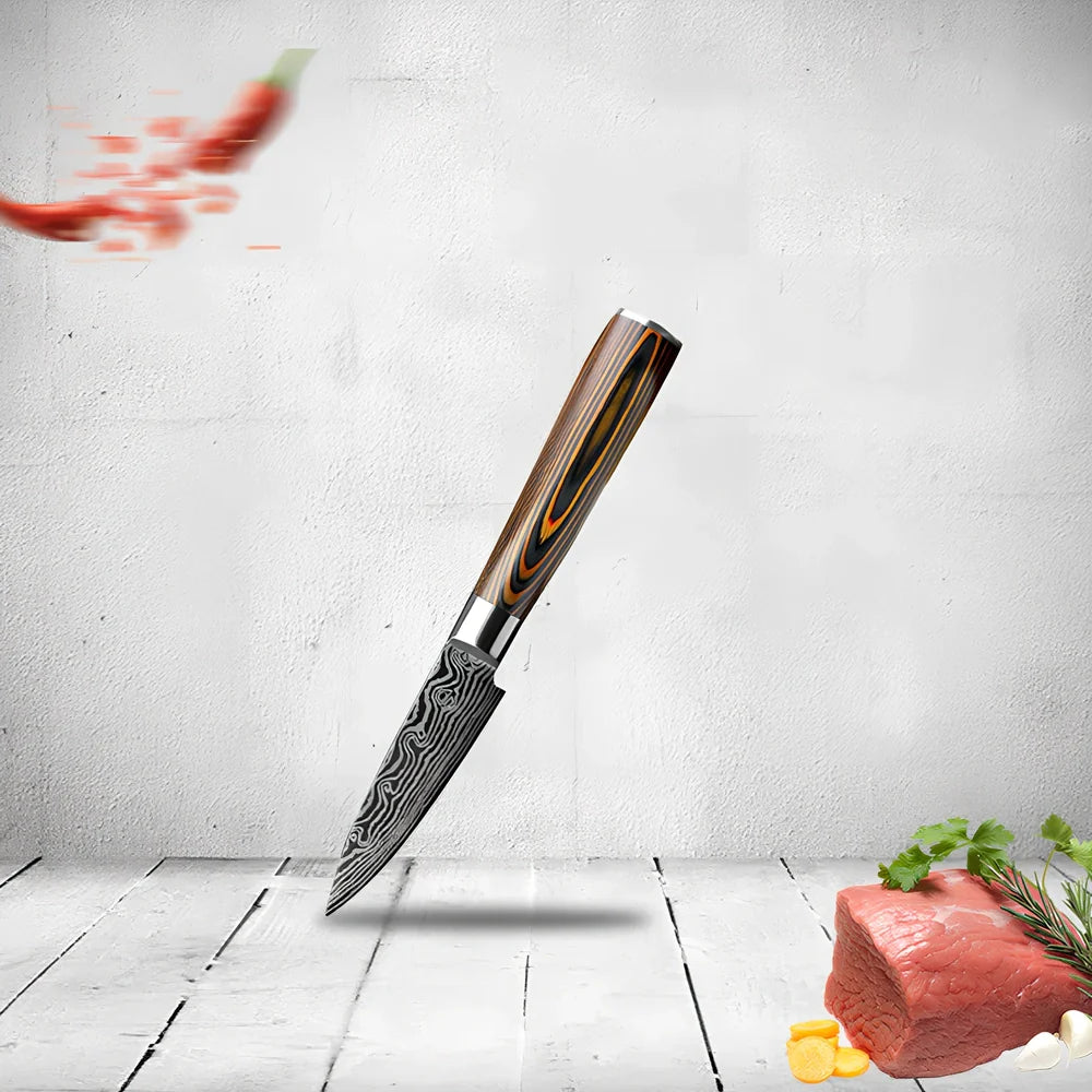 Laser pattern knife set with stainless steel chef, slicing, and fruit knives on a cutting board