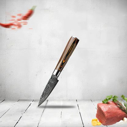 Laser pattern knife set with stainless steel chef, slicing, and fruit knives on a cutting board
