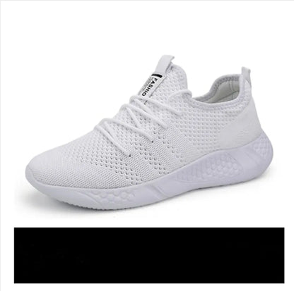 Men's black and white mesh sneakers with a lace-up front and round toe, shown on a plain background.