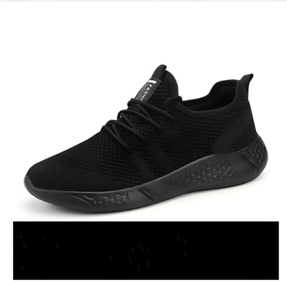 Men's black and white mesh sneakers with a lace-up front and round toe, shown on a plain background.