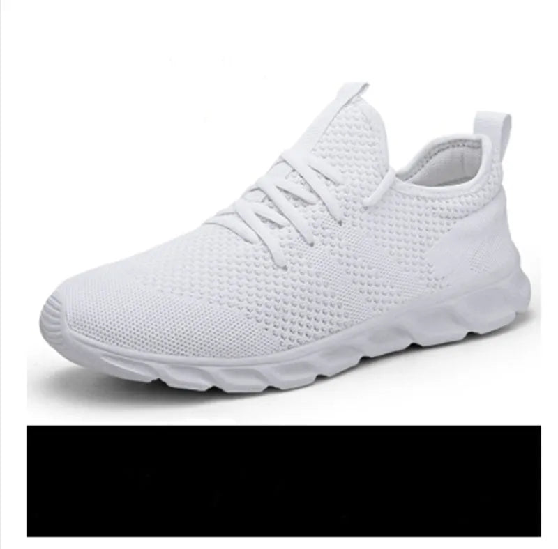 Men's black and white mesh sneakers with a lace-up front and round toe, shown on a plain background.