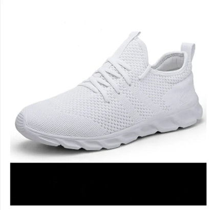 Men's black and white mesh sneakers with a lace-up front and round toe, shown on a plain background.