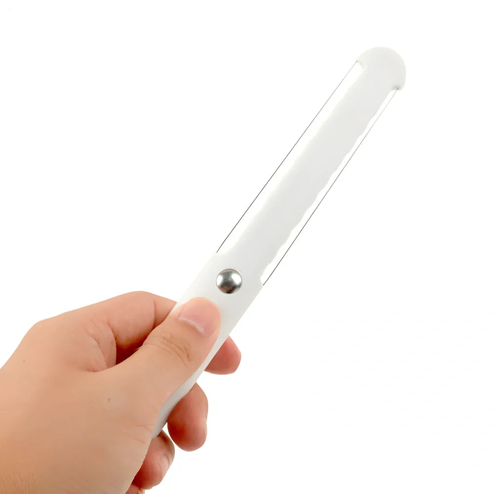 White plastic butter knife measuring 22.6cm long with modern simple design for food preparation