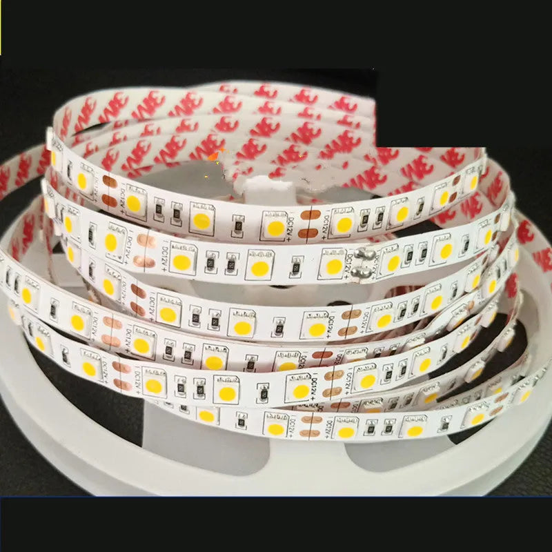 Close-up of a flexible white LED light strip with densely packed SMD chips, bent to show its flexibility.