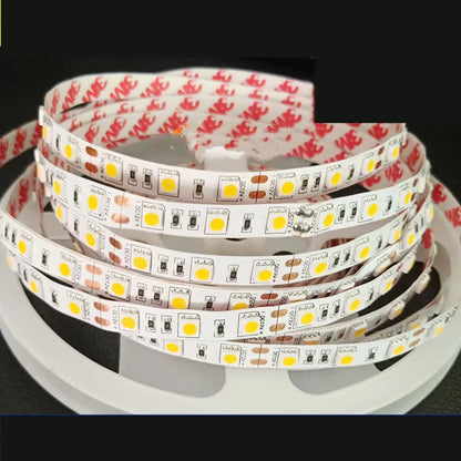 Close-up of a flexible white LED light strip with densely packed SMD chips, bent to show its flexibility.