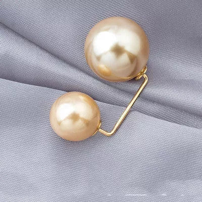Copper bow tie brooch with pearl detail for skirt waist