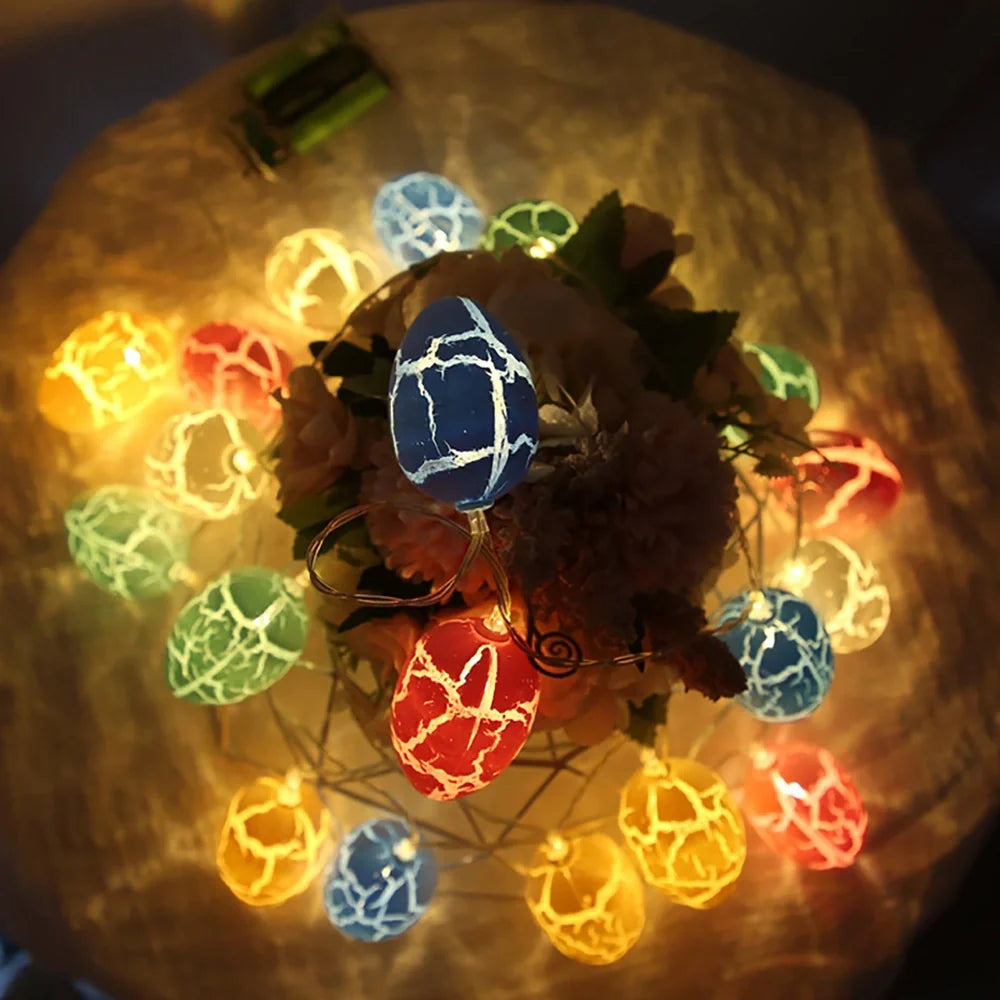 Crack egg LED string lights shaped around window with coloured plastic shells and flexible cable