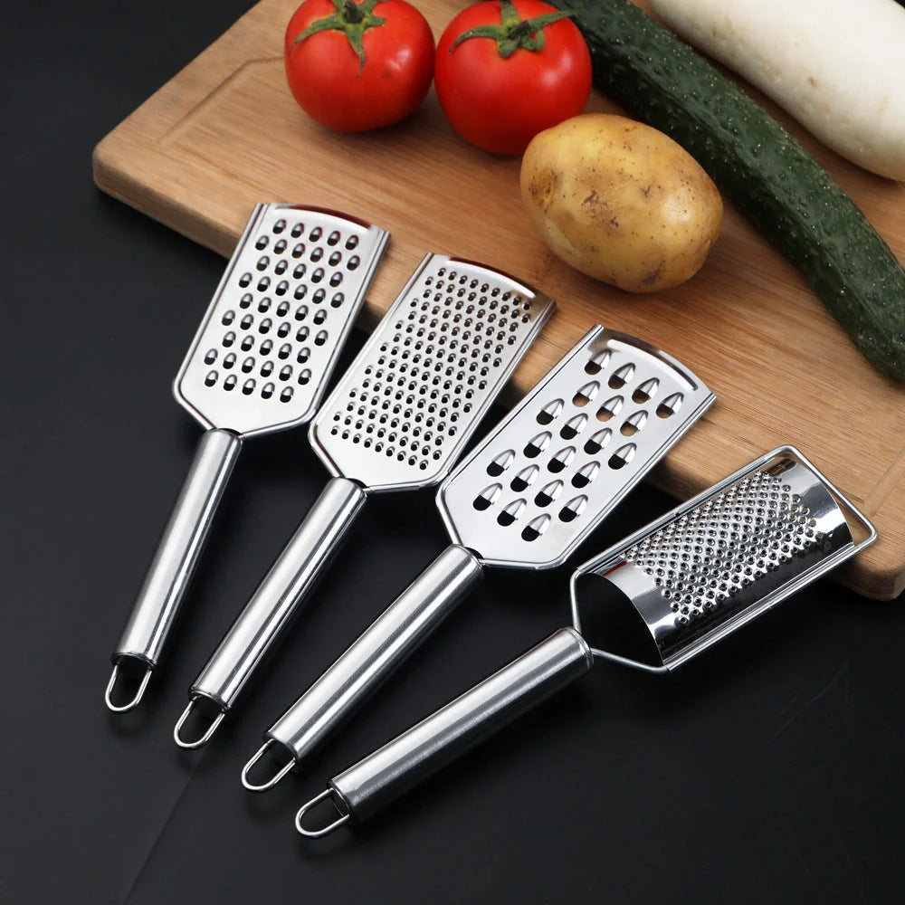 Stainless steel kitchen grater set with four grating options for cheese, vegetables, and ginger