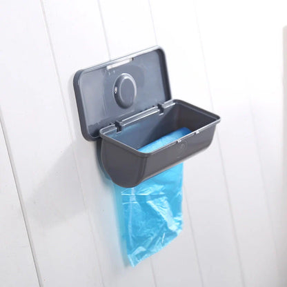 Wall-mounted plastic trash bag dispenser in white, grey, and pink for kitchen organization