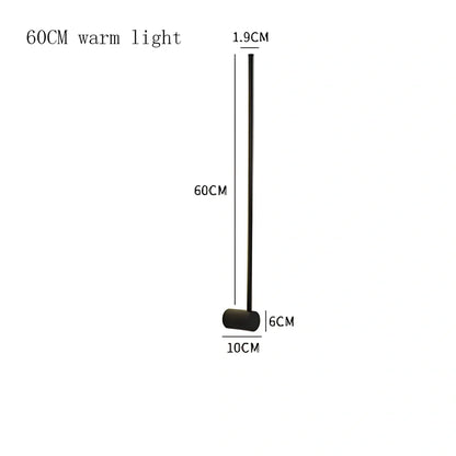 Black 60cm linear LED bathroom mirror lamp with acrylic shade mounted above bathroom mirror