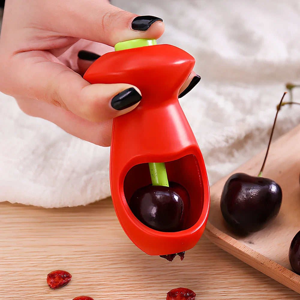 Red plastic fruit corer gadget, 5cm x 13cm, for removing cores from apples and pears in one plunge