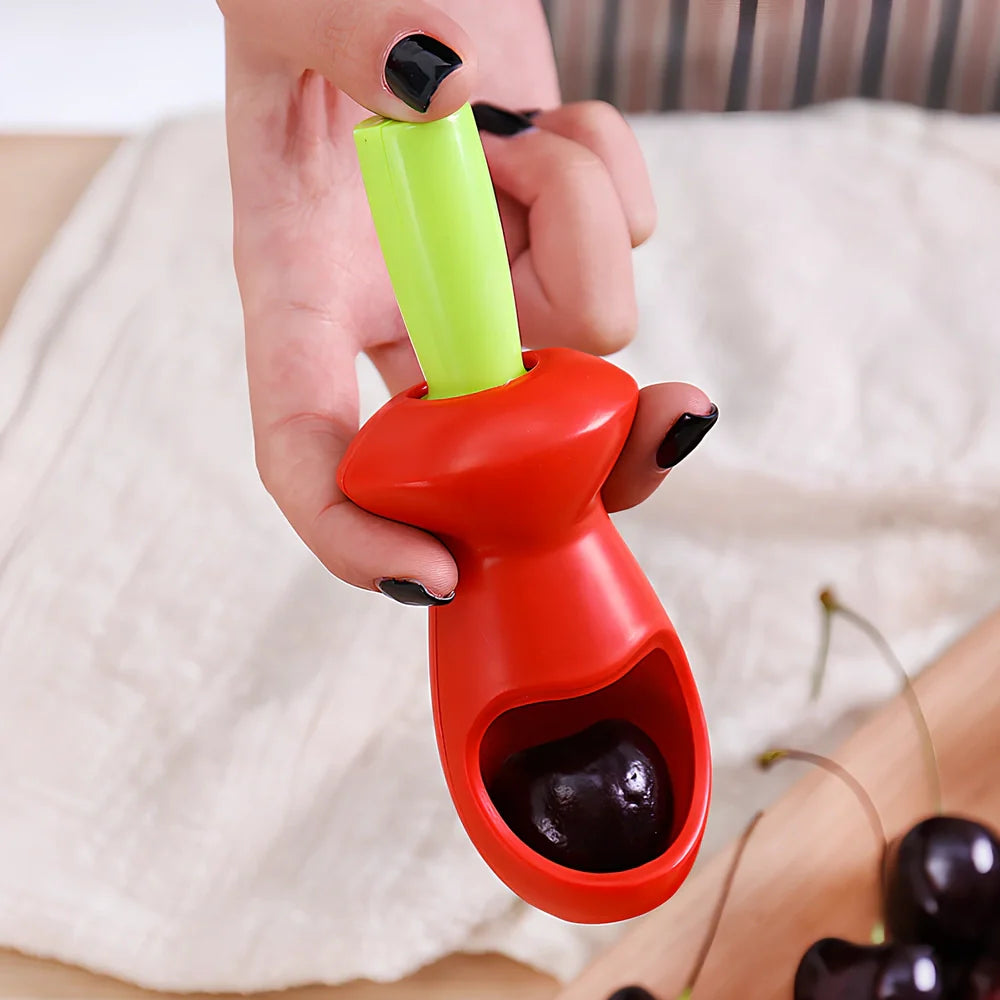 Red plastic fruit corer gadget, 5cm x 13cm, for removing cores from apples and pears in one plunge