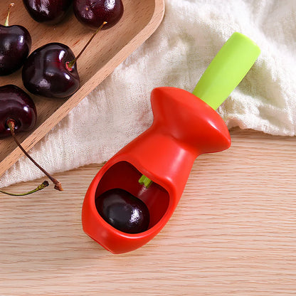 Red plastic fruit corer gadget, 5cm x 13cm, for removing cores from apples and pears in one plunge
