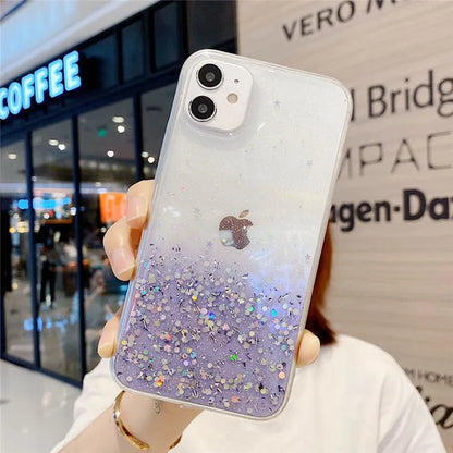 Transparent glitter epoxy soft shell case for Apple iPhone on a table.
