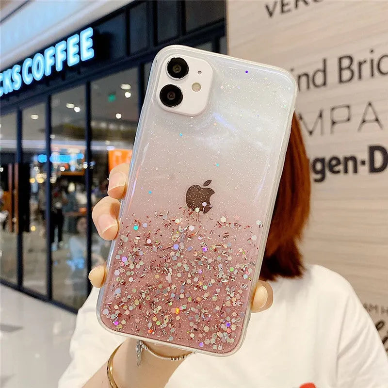 Transparent glitter epoxy soft shell case for Apple iPhone on a table.