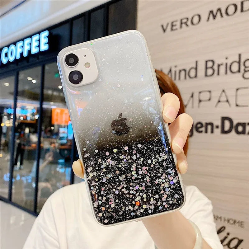 Transparent glitter epoxy soft shell case for Apple iPhone on a table.