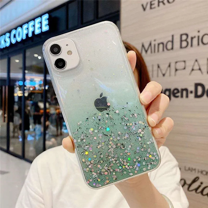 Transparent glitter epoxy soft shell case for Apple iPhone on a table.