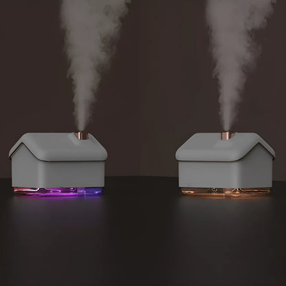 White igloo-shaped ultrasonic humidifier and essential oil diffuser with LED light on a wooden table.