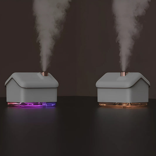 White igloo-shaped ultrasonic humidifier and essential oil diffuser with LED light on a wooden table.