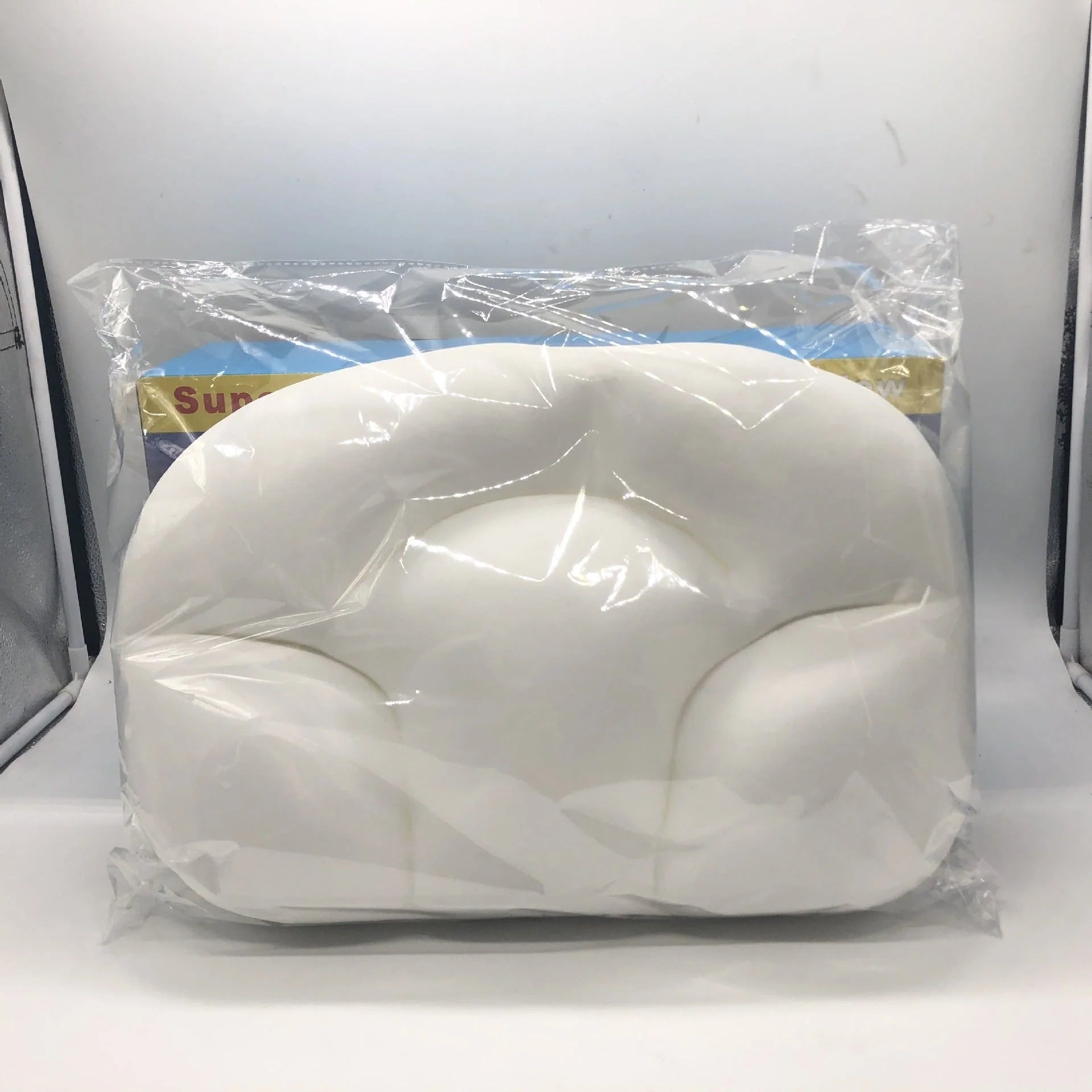 Round foam neck support pillow with pure cotton cover and adjustable height for personalized comfort