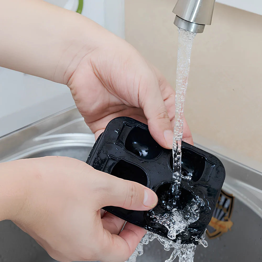 Silicone skull ice tray with detailed 3D cavities creating Halloween-themed ice sculptures