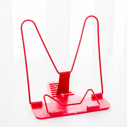 Reading frame holding a book at an upright angle with metal and plastic construction