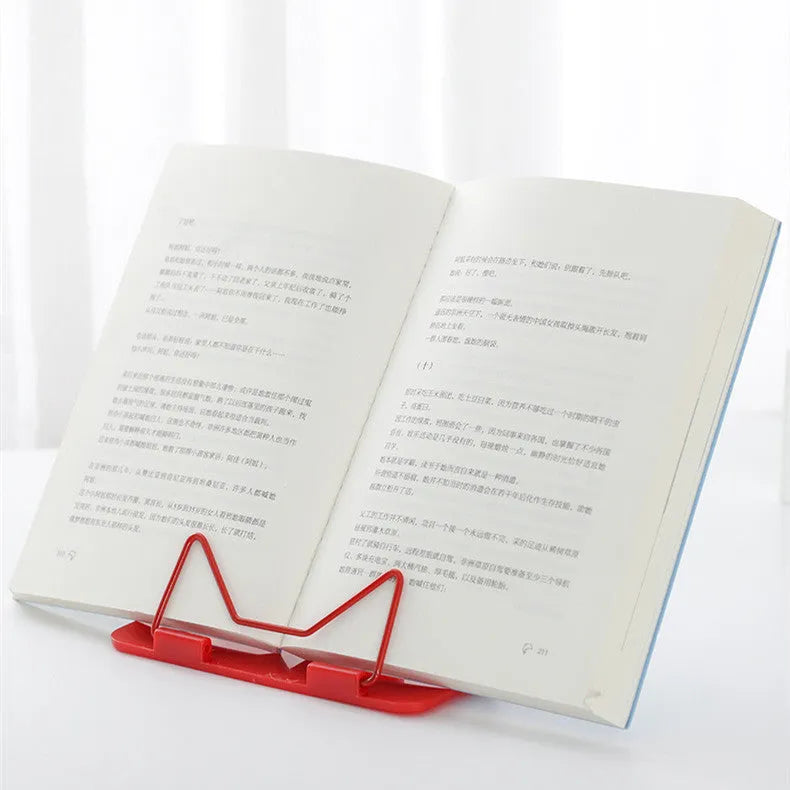 Reading frame holding a book at an upright angle with metal and plastic construction