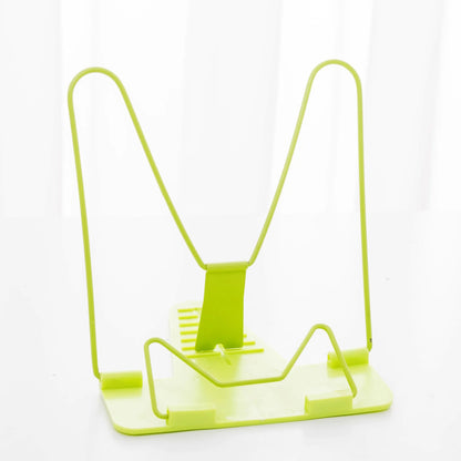 Reading frame holding a book at an upright angle with metal and plastic construction